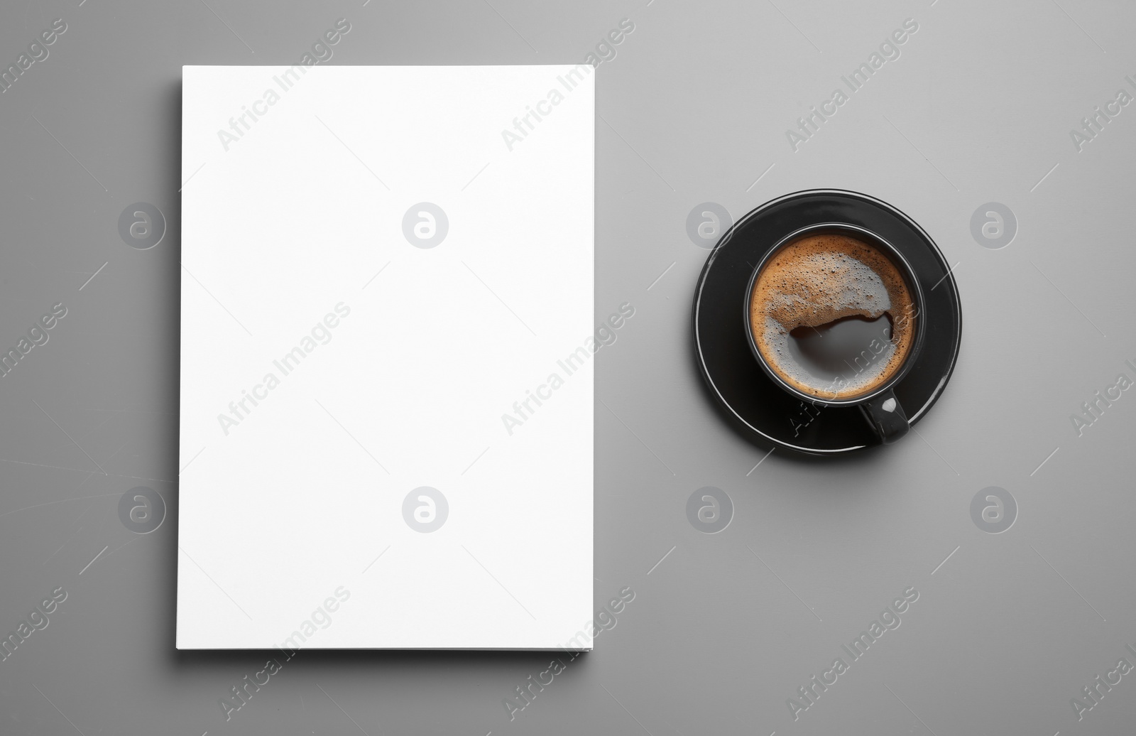 Photo of Blank paper sheets for brochure and cup of coffee on grey background, flat lay. Mock up