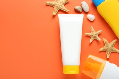 Photo of Suntan products and seashells on orange background, flat lay. Space for text