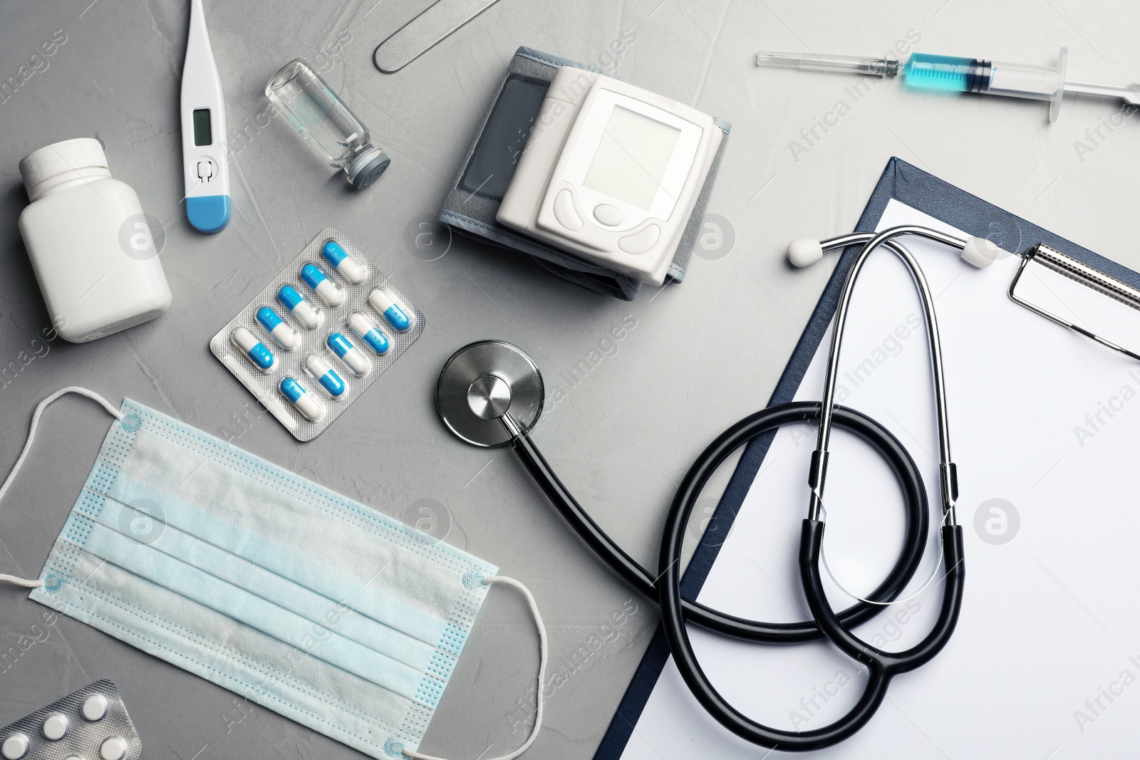 Photo of Flat lay composition with medical objects on grey background