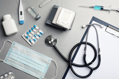 Flat lay composition with medical objects on grey background