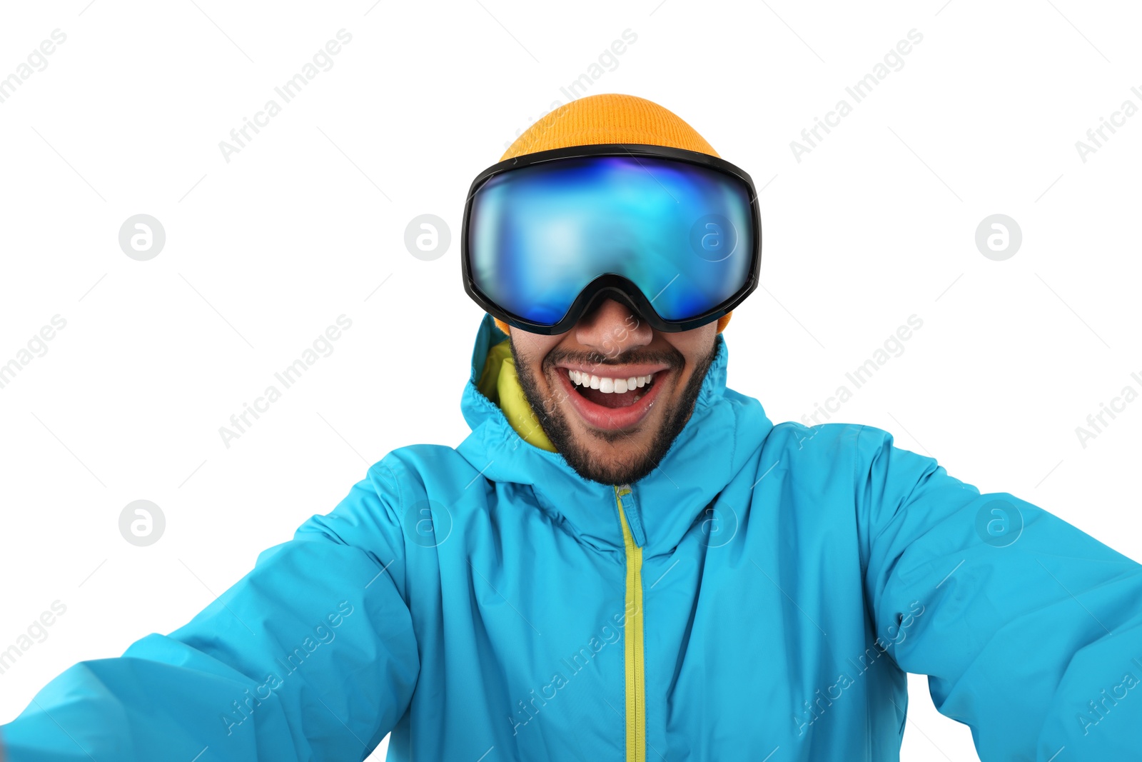 Photo of Smiling young man in ski goggles taking selfie on white background