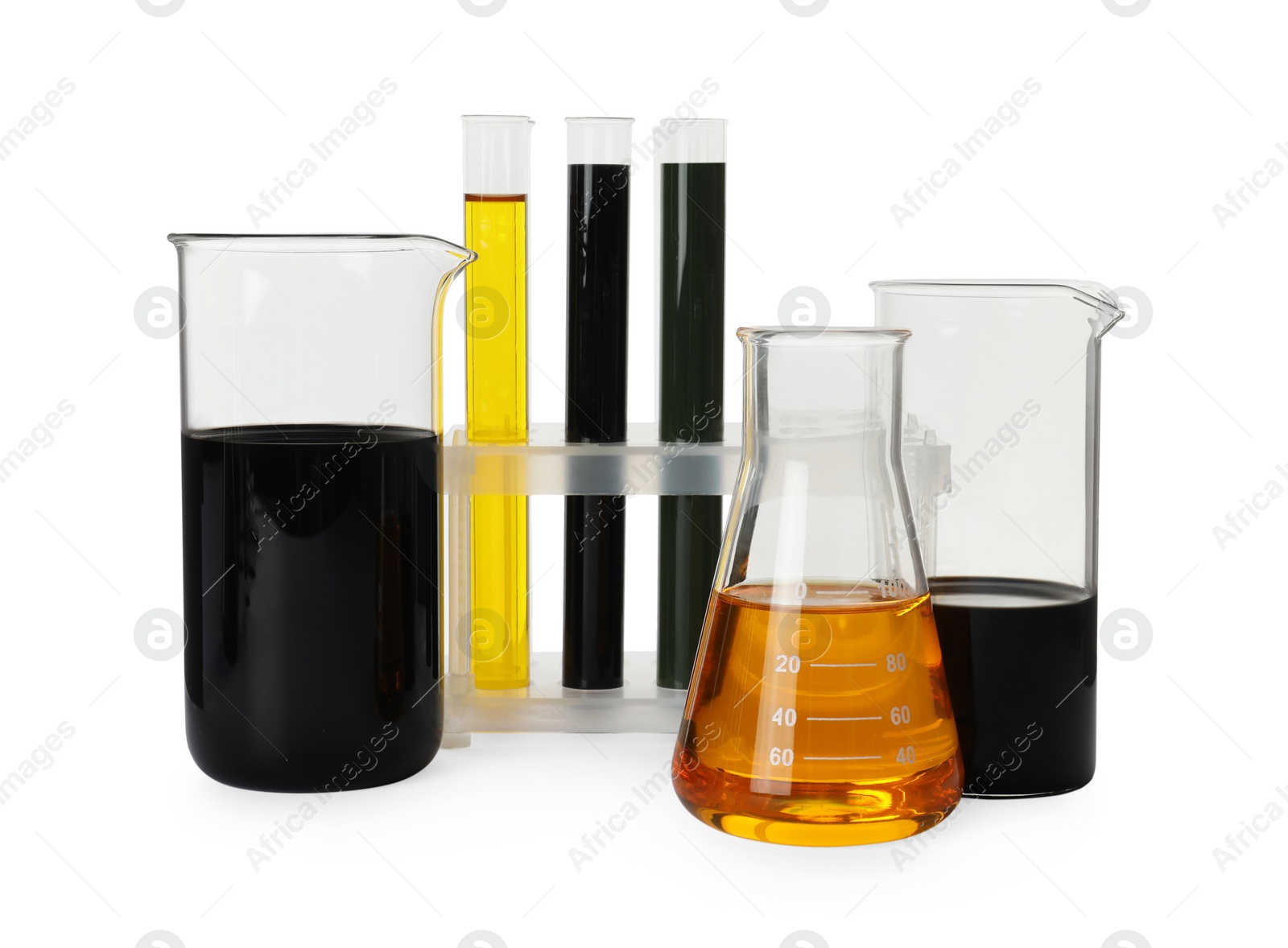 Photo of Laboratory glassware with different types of crude oil isolated on white