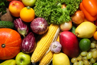 Assortment of fresh organic fruits and vegetables as background, closeup