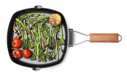 Photo of Grill pan with tasty cooked broccolini, mushrooms, tomatoes and lemon isolated on white, top view