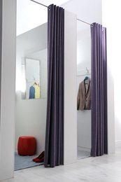 Empty dressing rooms in fashion store. Stylish interior