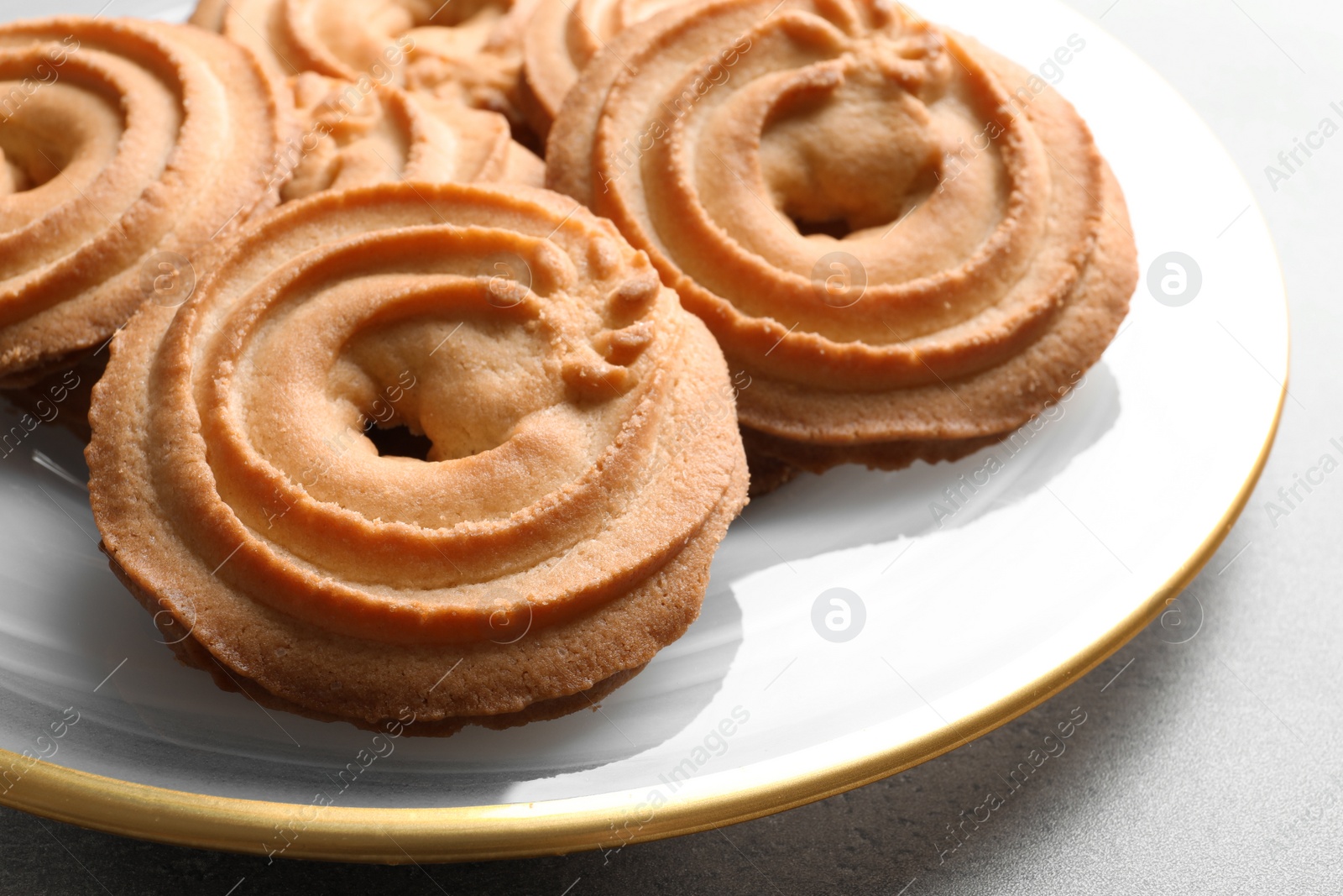 Photo of Plate with Danish butter cookies on table, closeup