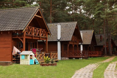Photo of Beautiful view of wooden summer houses with porches