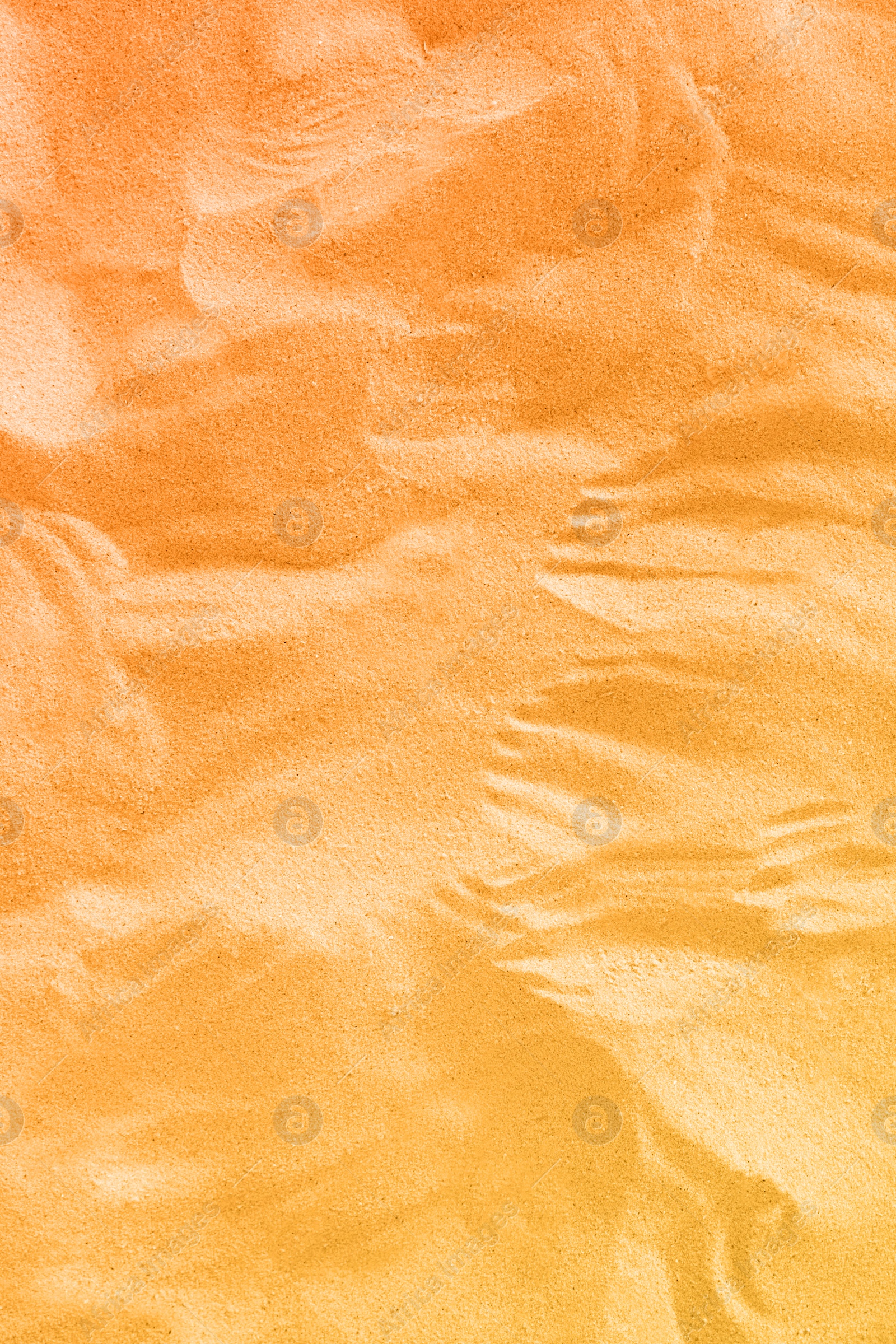 Image of Orange beach sand as background, closeup view