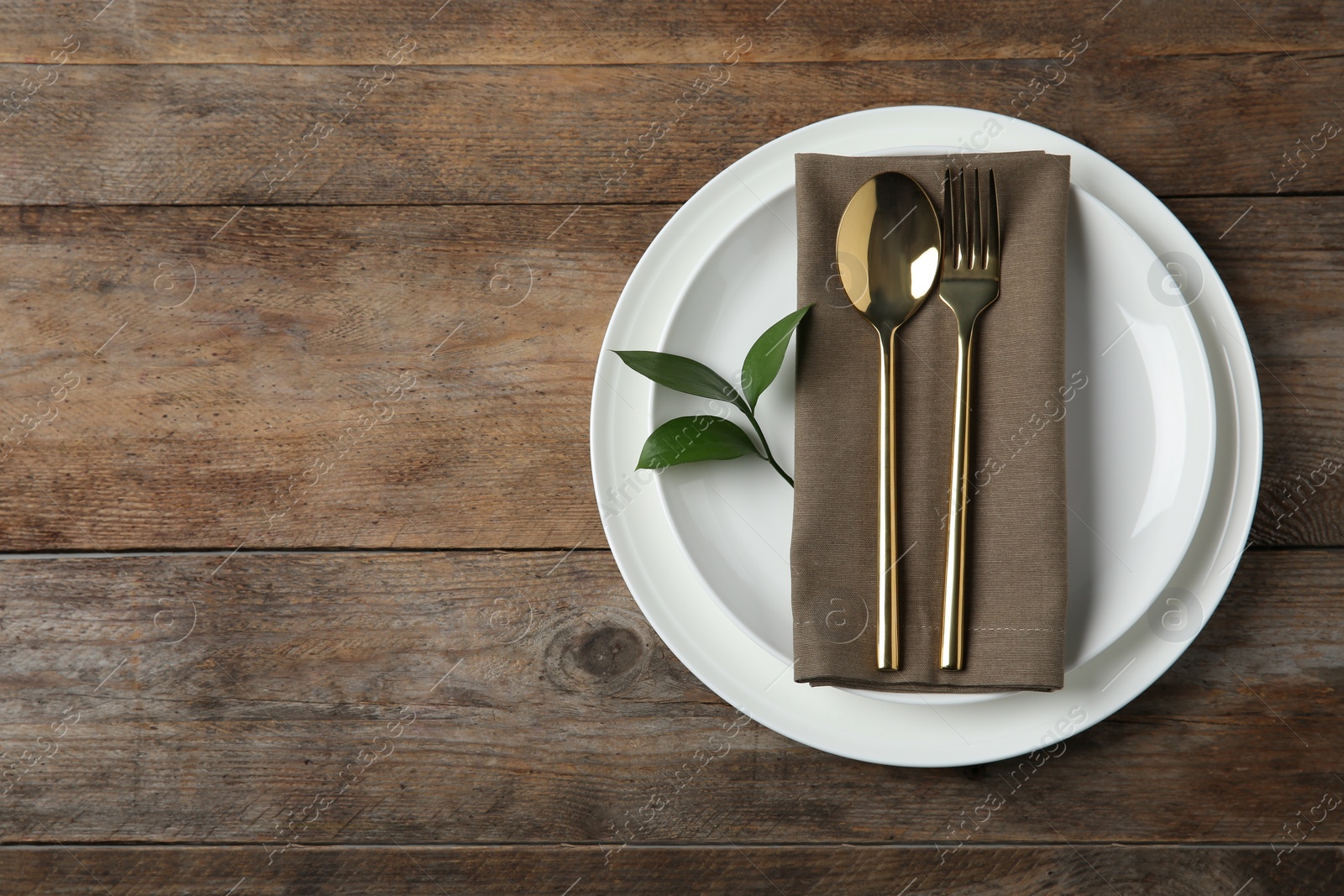 Photo of Beautiful table setting on wooden background, flat lay. Space for text