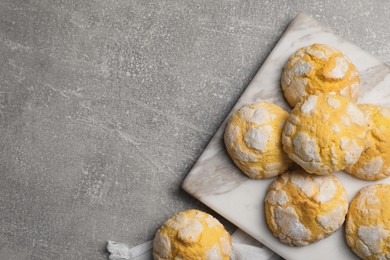 Photo of Delicious lemon cookies on grey marble table, flat lay. Space for text