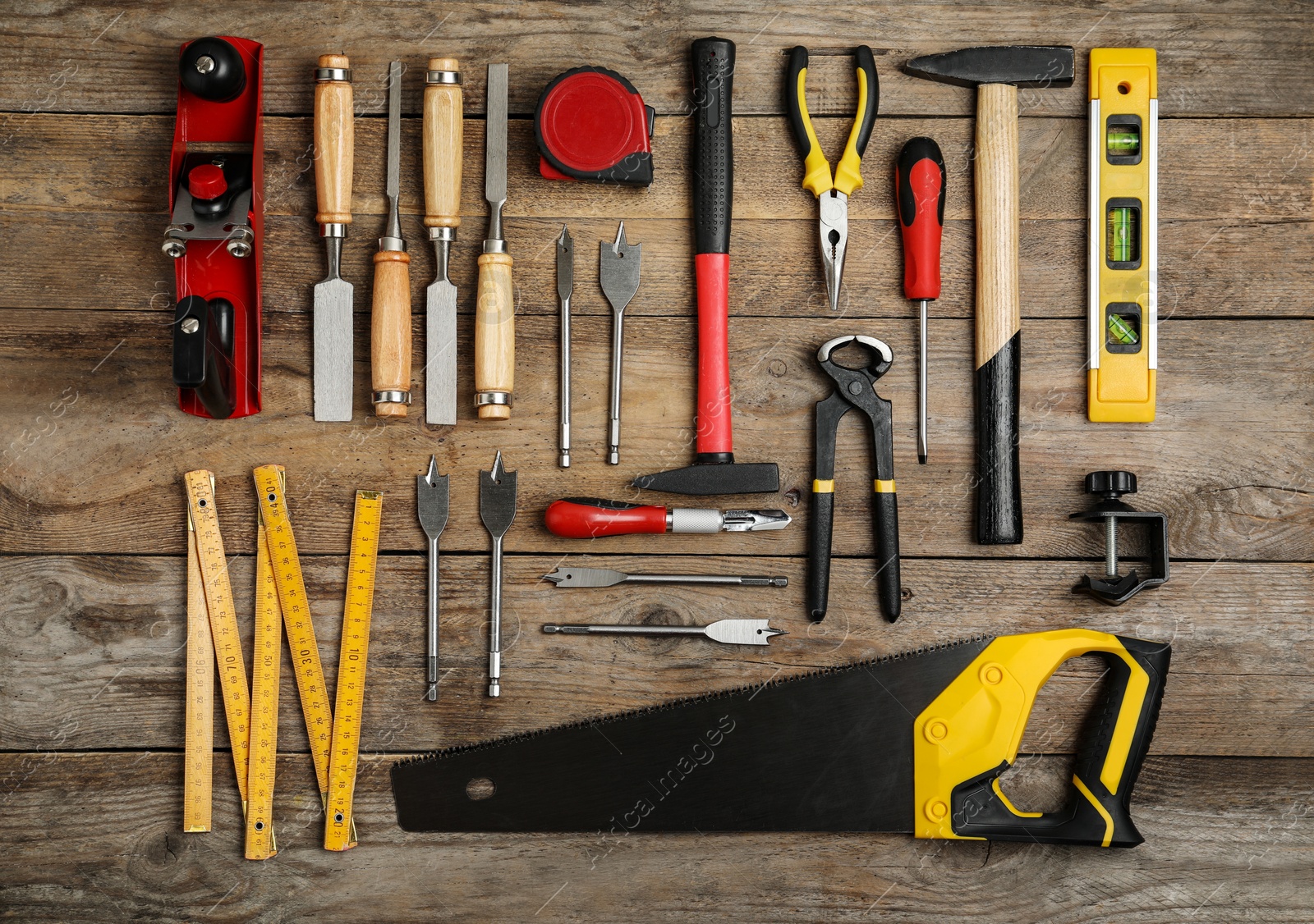 Photo of Flat lay composition with carpenter's tools on wooden background