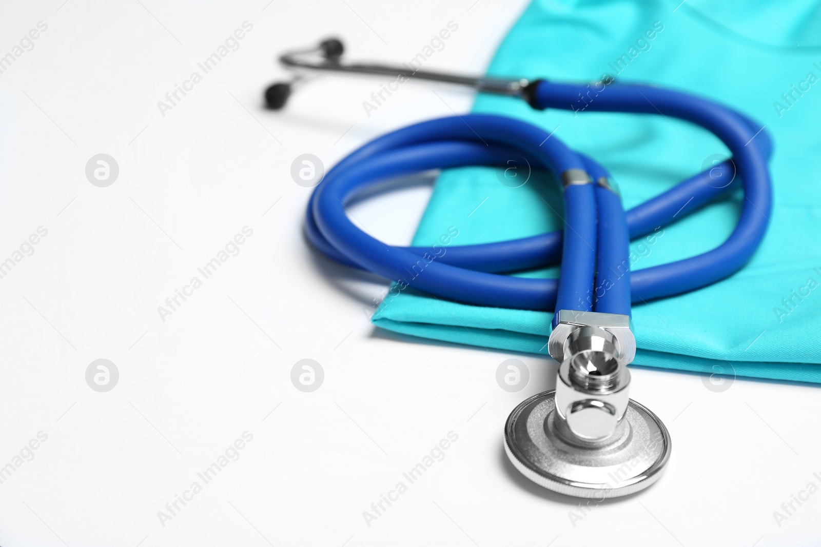 Photo of Stethoscope on light background, closeup. Medical equipment