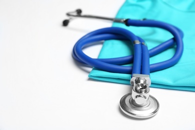 Stethoscope on light background, closeup. Medical equipment