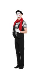 Photo of Funny mime artist in beret posing on white background