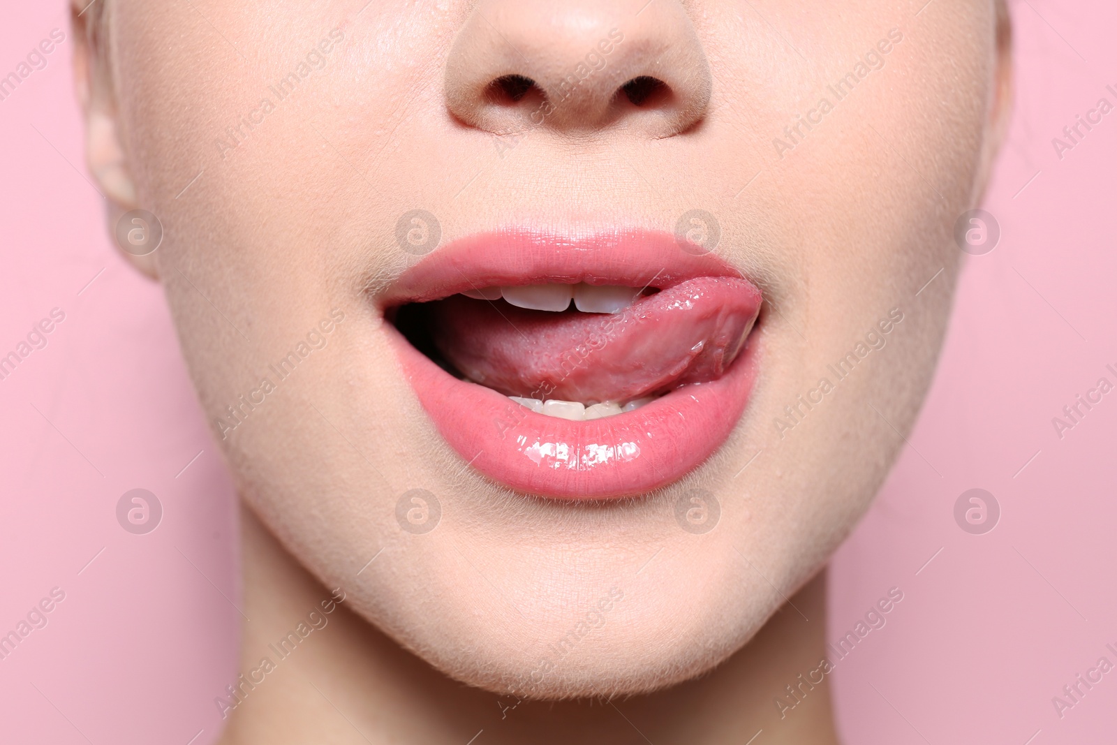 Photo of Beautiful young woman with perfect lips makeup on color background, closeup