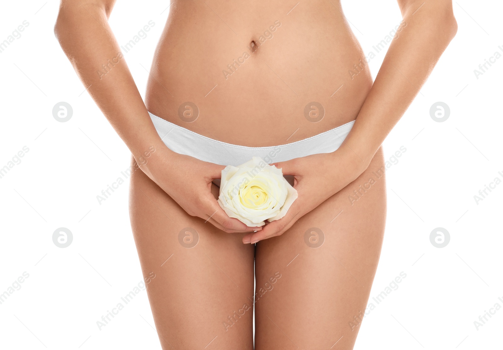 Photo of Woman with rose showing smooth skin on white background, closeup. Brazilian bikini epilation