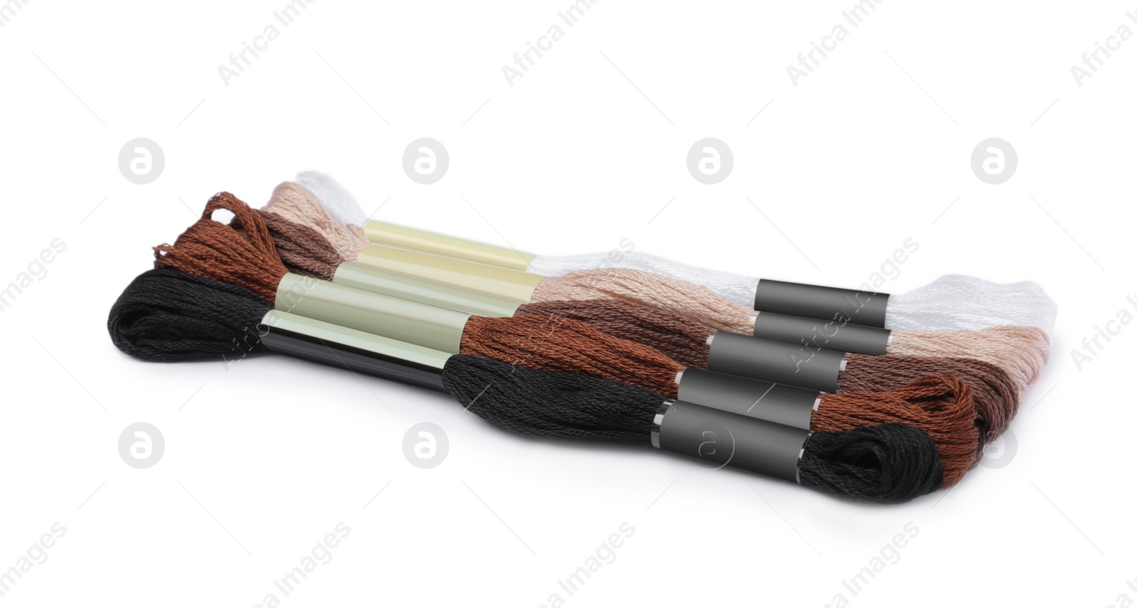 Photo of Set of colorful embroidery threads on white background