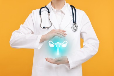 Doctor and illustration of female reproductive system on orange background, closeup