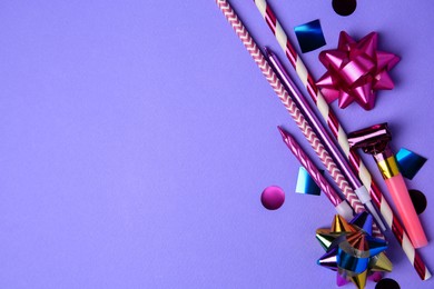 Photo of Party blower, colorful confetti and other festive decor on violet background, flat lay. Space for text
