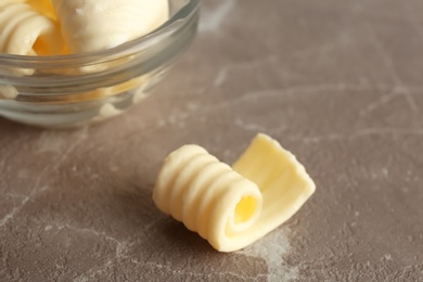 Fresh butter curl on table, closeup