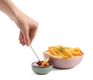Photo of Woman dipping french fries into ketchup on white background, closeup