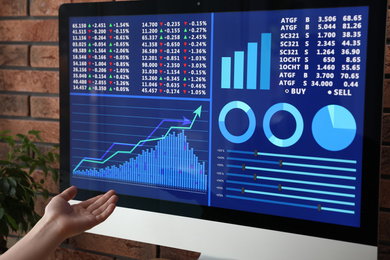 Photo of Woman working with modern computer indoors, closeup