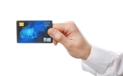 Photo of Young man holding credit card on white background