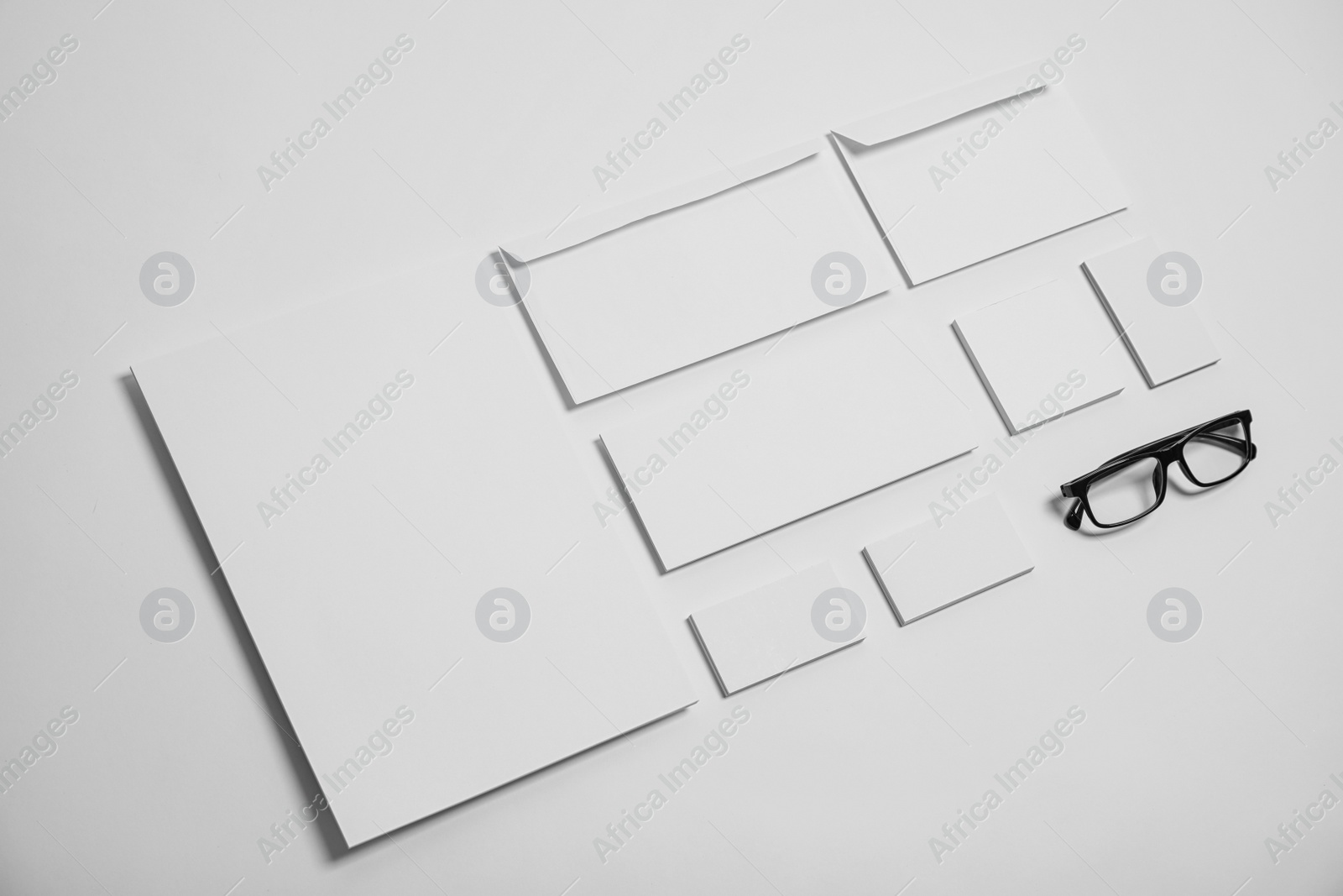 Photo of Composition with stationery on light background. Mock up for design