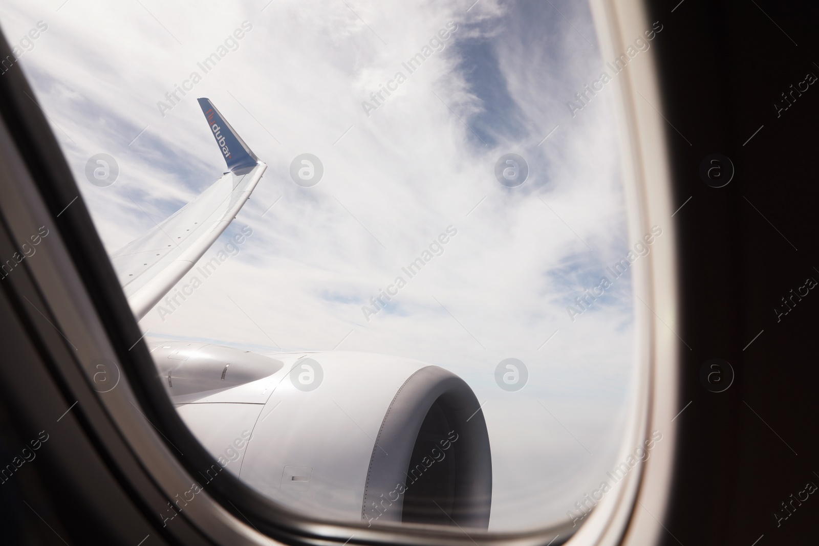 Photo of DUBAI, UNITED ARAB EMIRATES - NOVEMBER 06, 2018: Picturesque view of cloudy sky from Flydubai plane