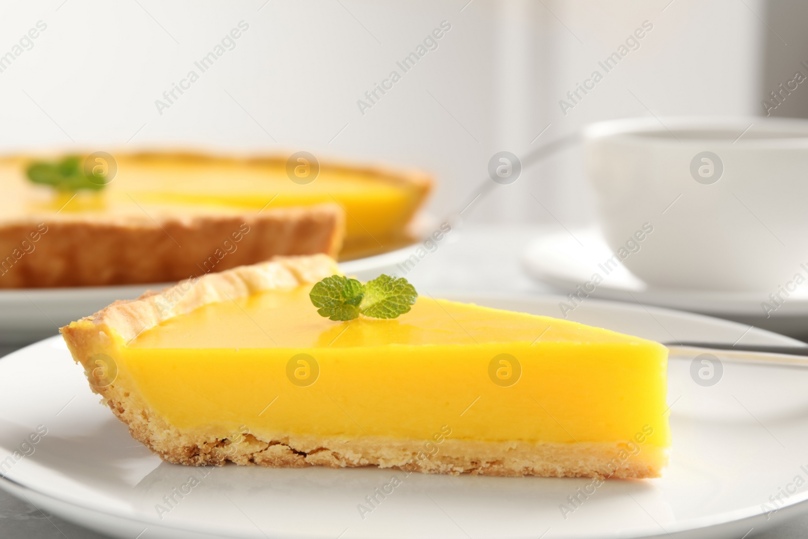 Photo of Slice of delicious homemade lemon pie on plate