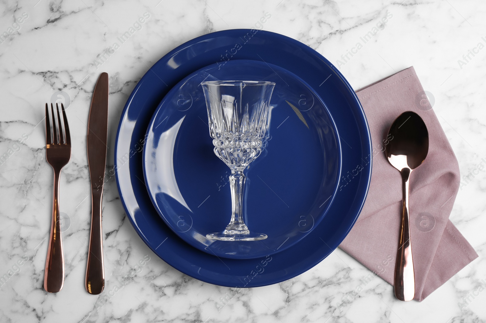 Photo of Elegant table setting on white marble background, top view