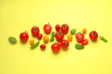 Photo of Flat lay composition with cherry tomatoes on color background