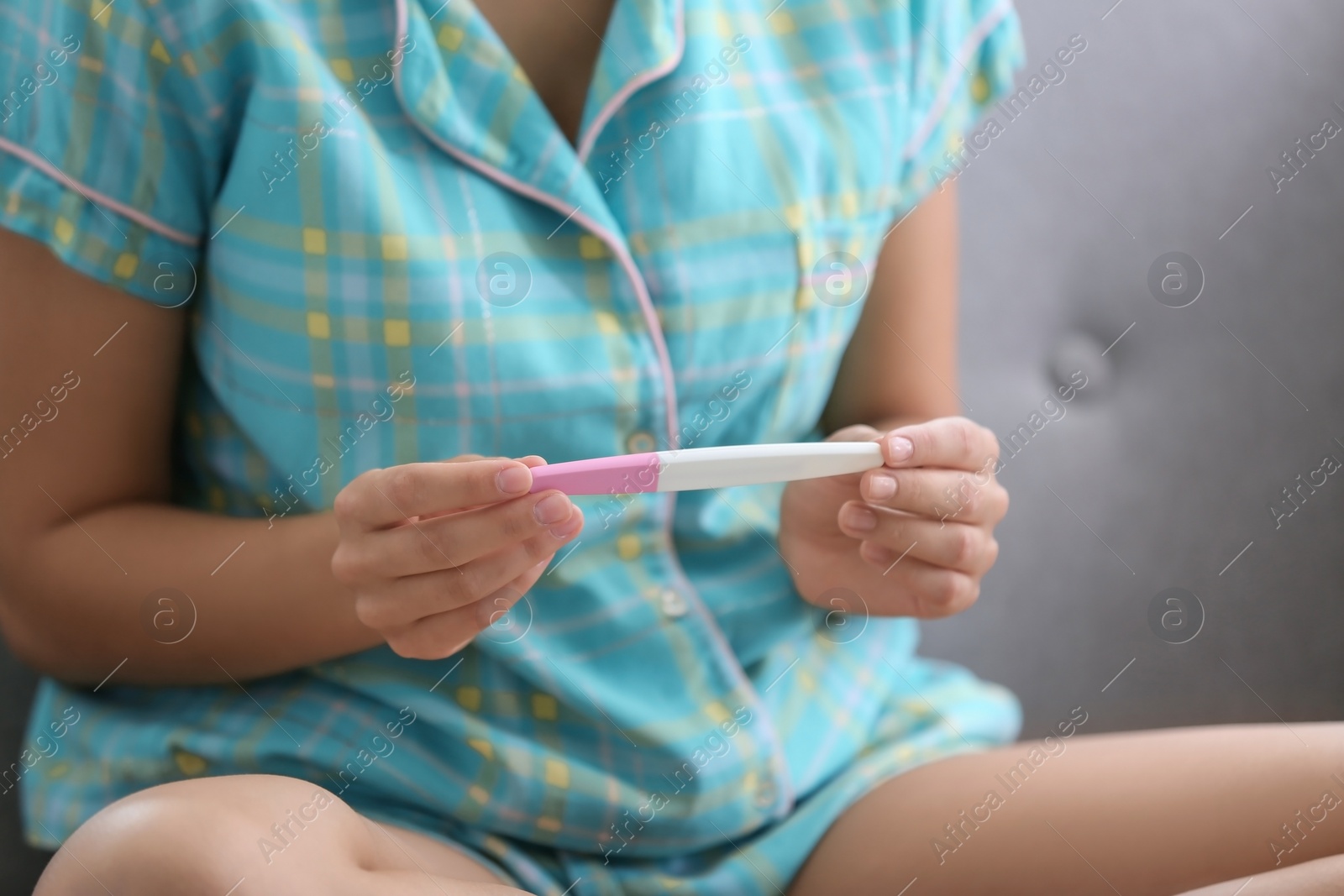 Photo of Young woman with pregnancy test, closeup. Gynecology