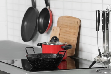 Set of clean cookware and utensils in kitchen