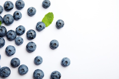 Flat lay composition with tasty blueberry and space for text on white background