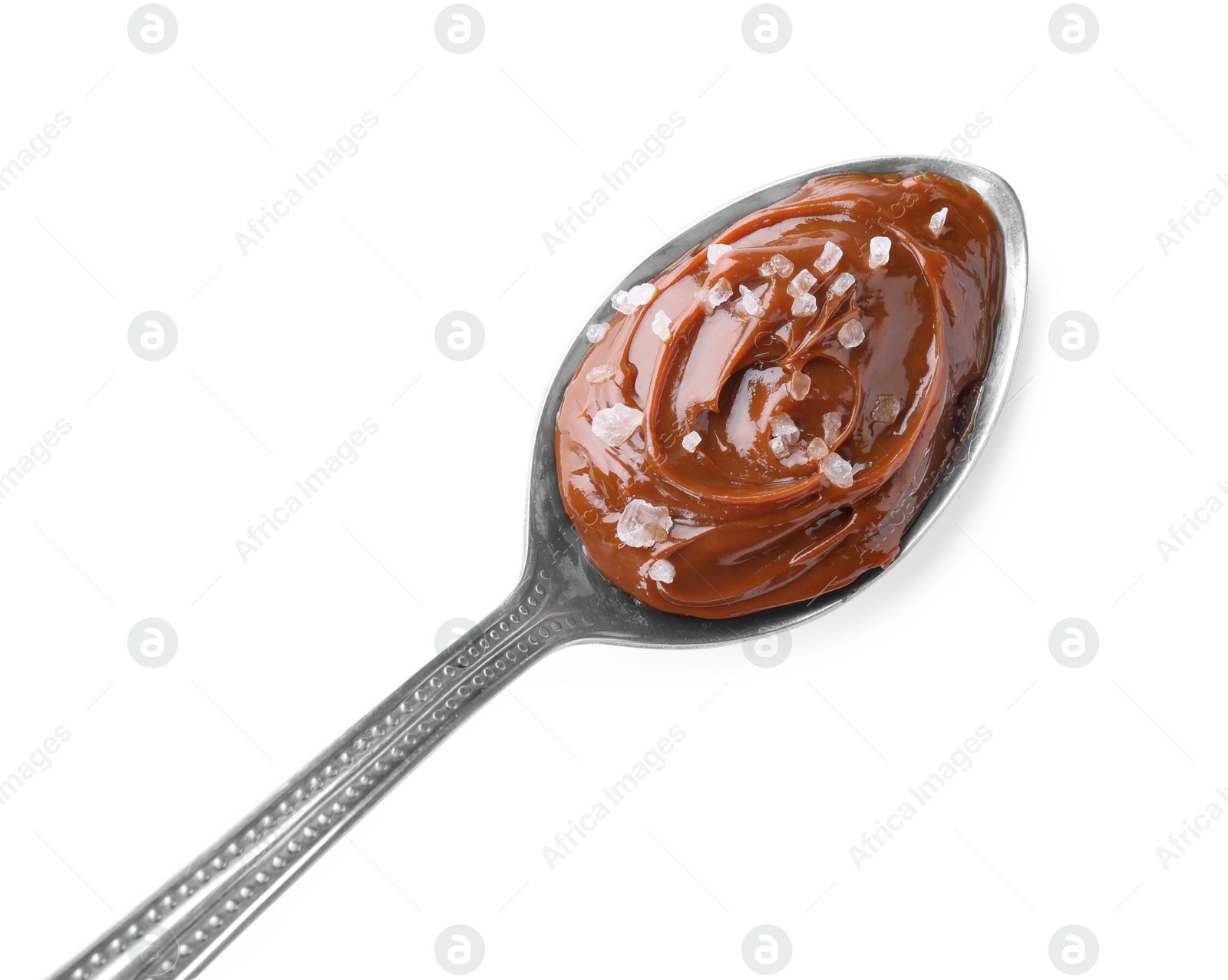Photo of Salted caramel in spoon isolated on white