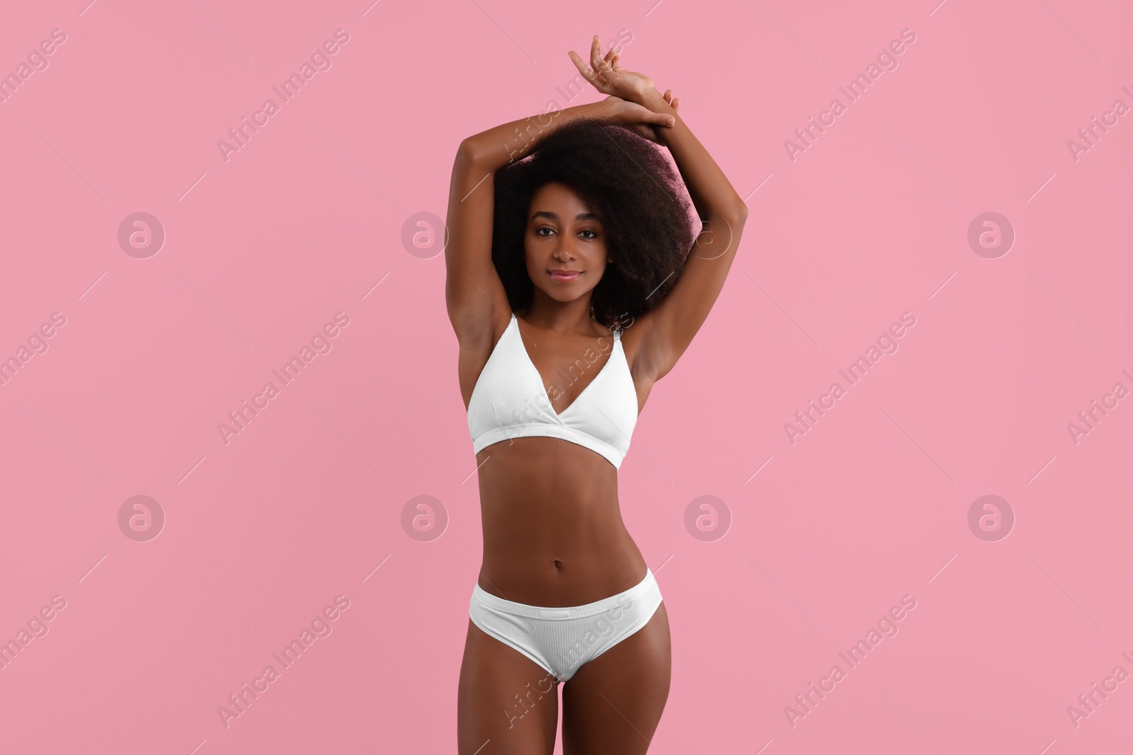 Photo of Beautiful woman in stylish bikini on pink background