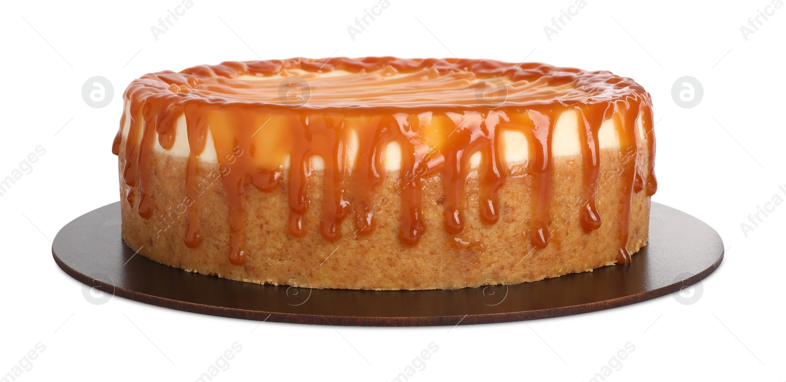 Photo of Delicious cheesecake with caramel isolated on white