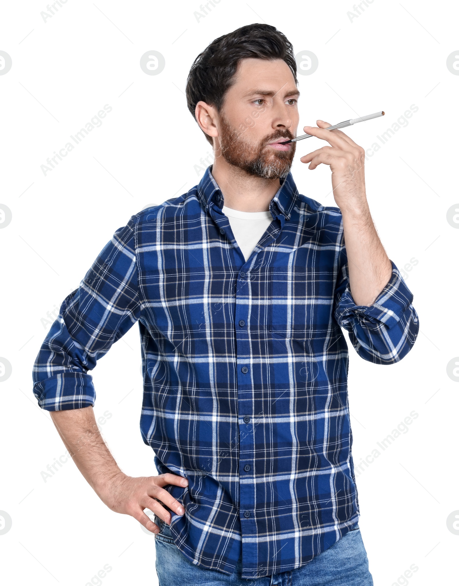 Photo of Man using long cigarette holder for smoking isolated on white