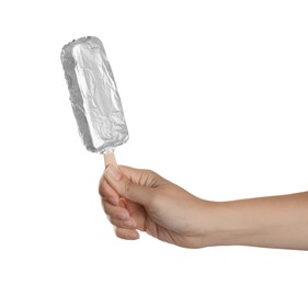 Photo of Woman holding ice cream wrapped in foil on white background, closeup