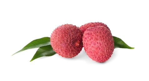 Photo of Fresh ripe lychees with green leaves on white background 