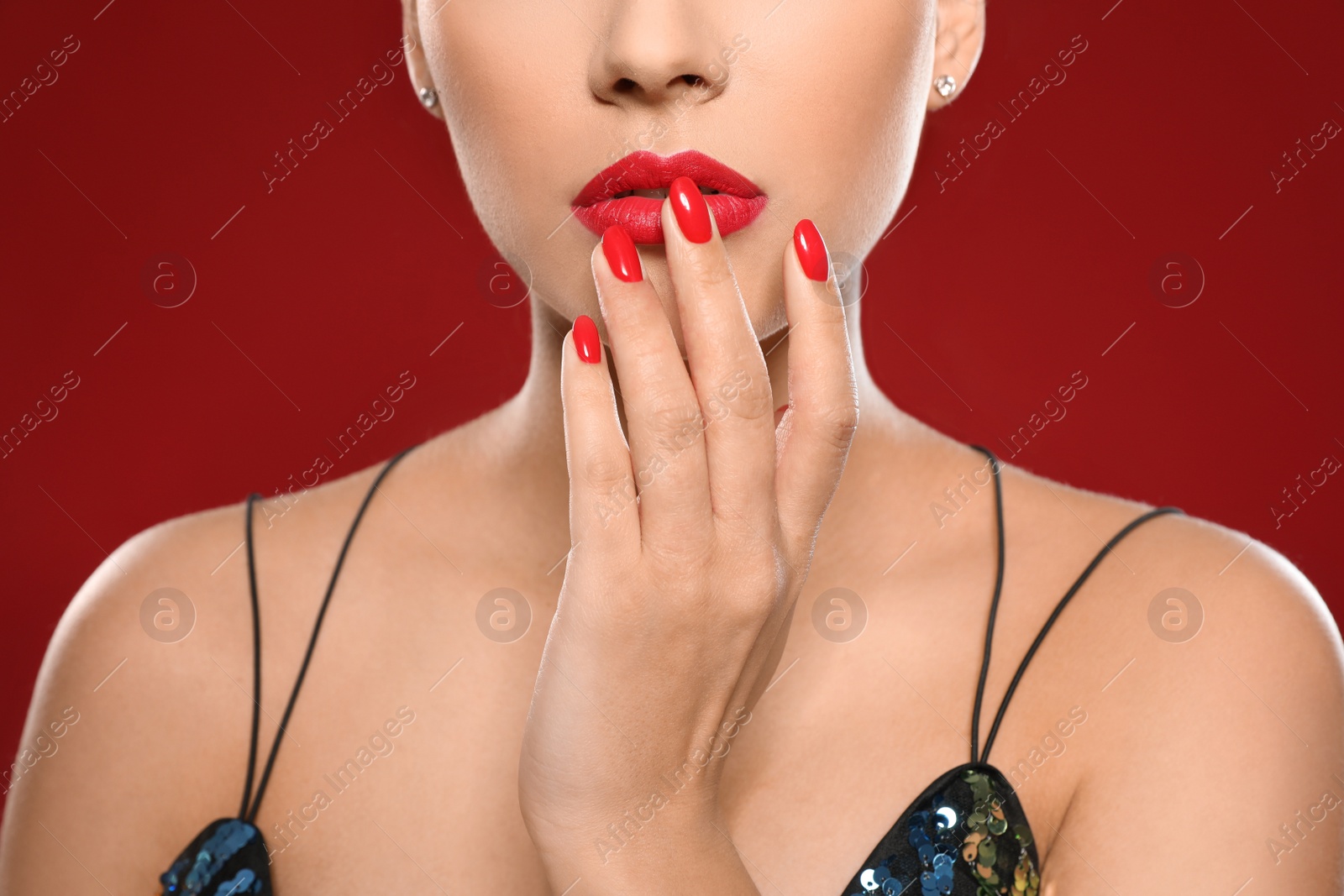 Photo of Beautiful young woman with bright manicure on color background, closeup. Nail polish trends