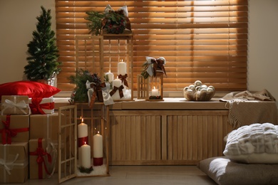 Beautiful wooden Christmas lanterns in decorated room