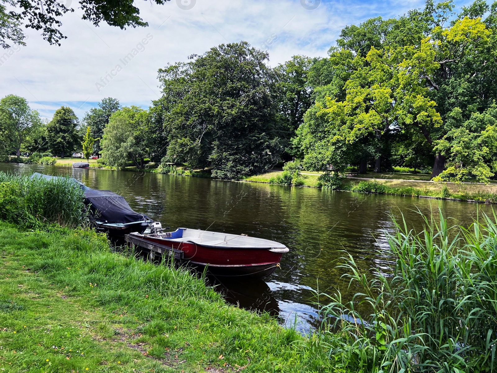 Photo of Beautiful view of canal with moored boats on sunny day