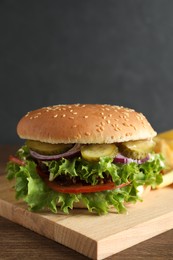 Photo of Delicious burger with beef patty and lettuce on wooden table