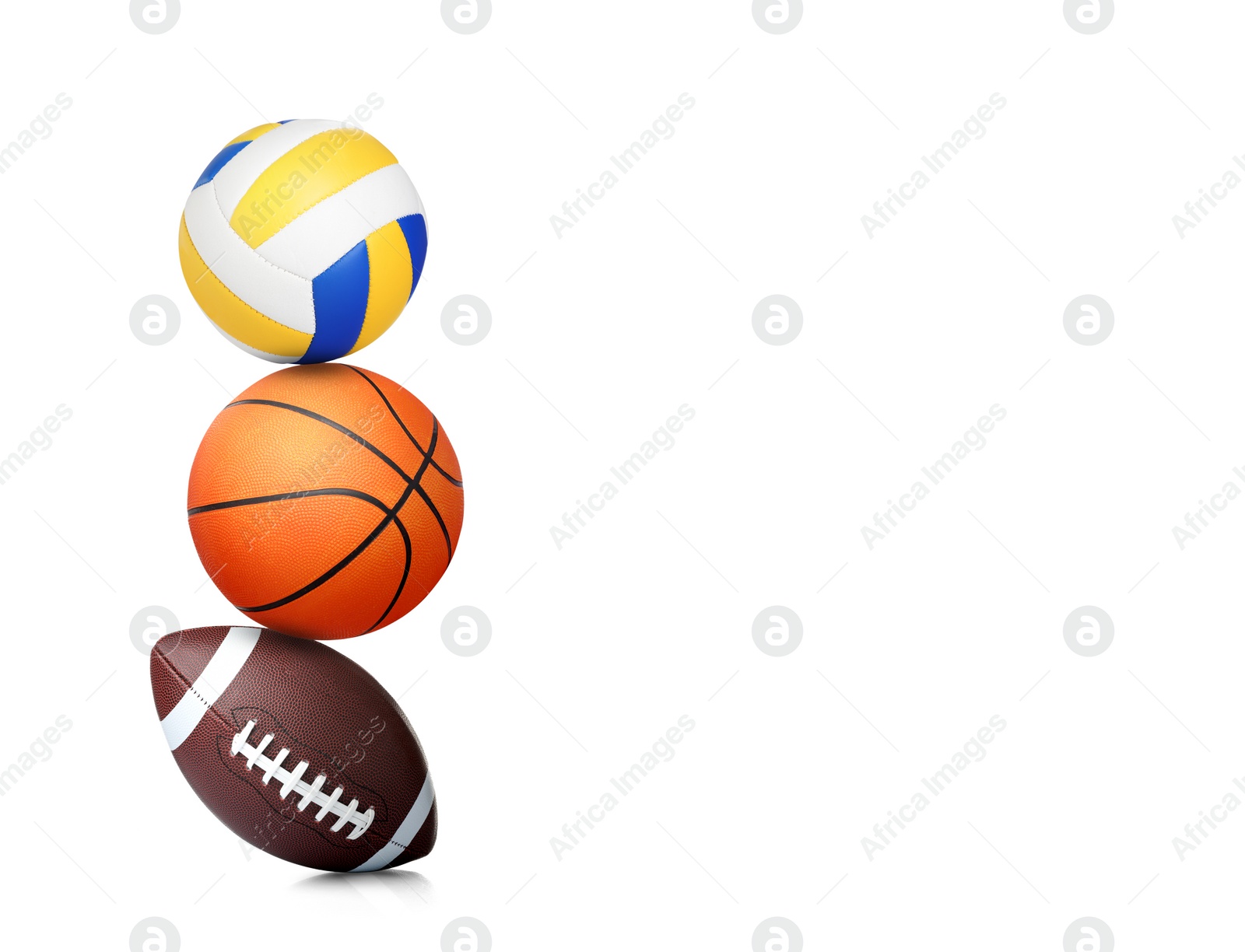 Image of Stack of different sport balls on white background