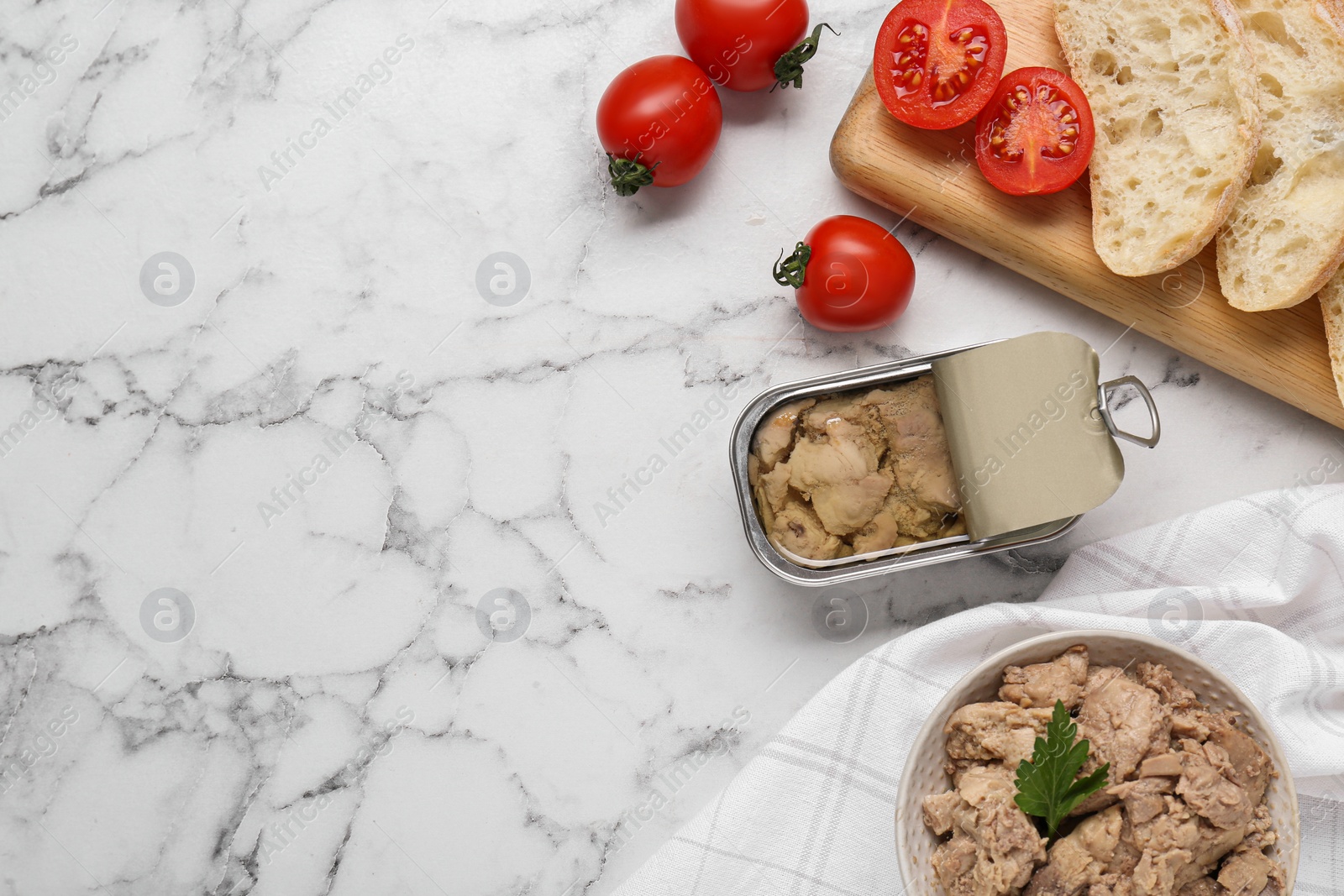 Photo of Flat lay composition with tasty cod liver and different products on white marble table. Space for text