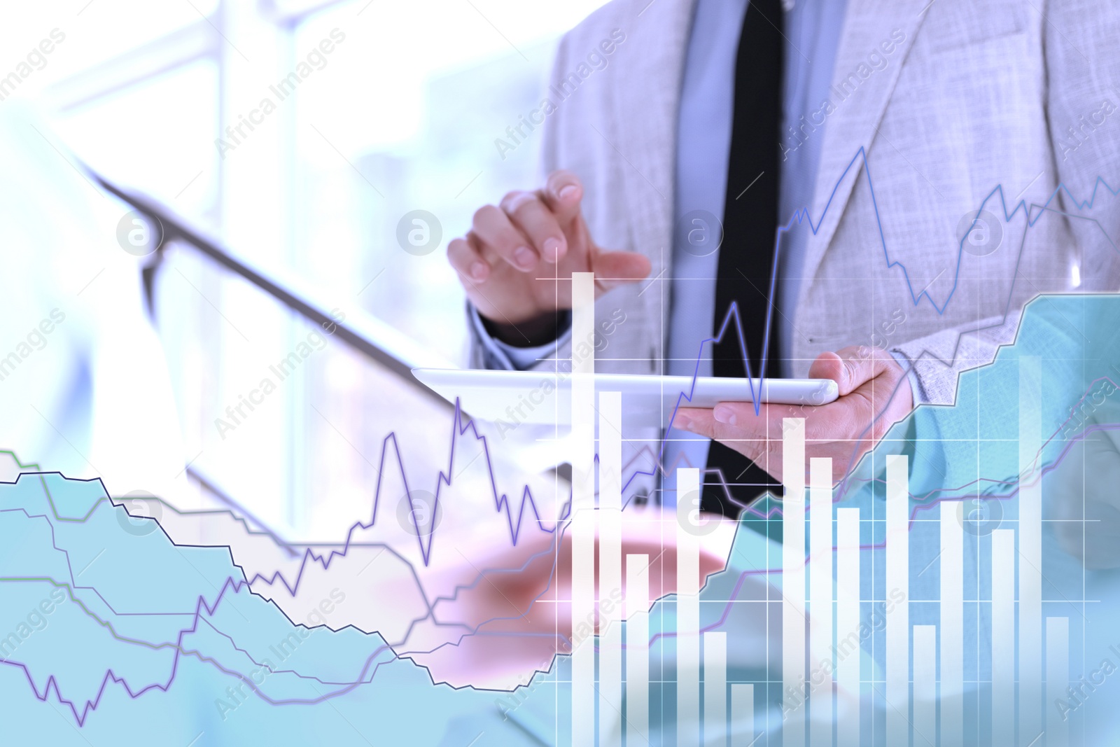 Image of Forex trading. Double exposure of charts and man using tablet computer, closeup