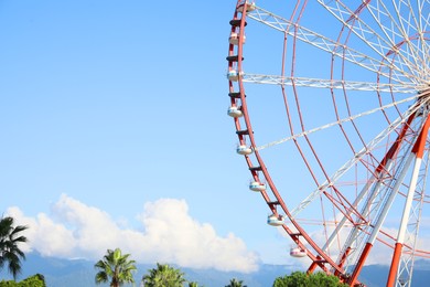 Beautiful large Ferris wheel outdoors, space for text