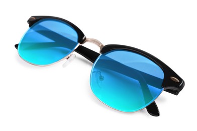 Stylish sunglasses with light blue lenses on white background